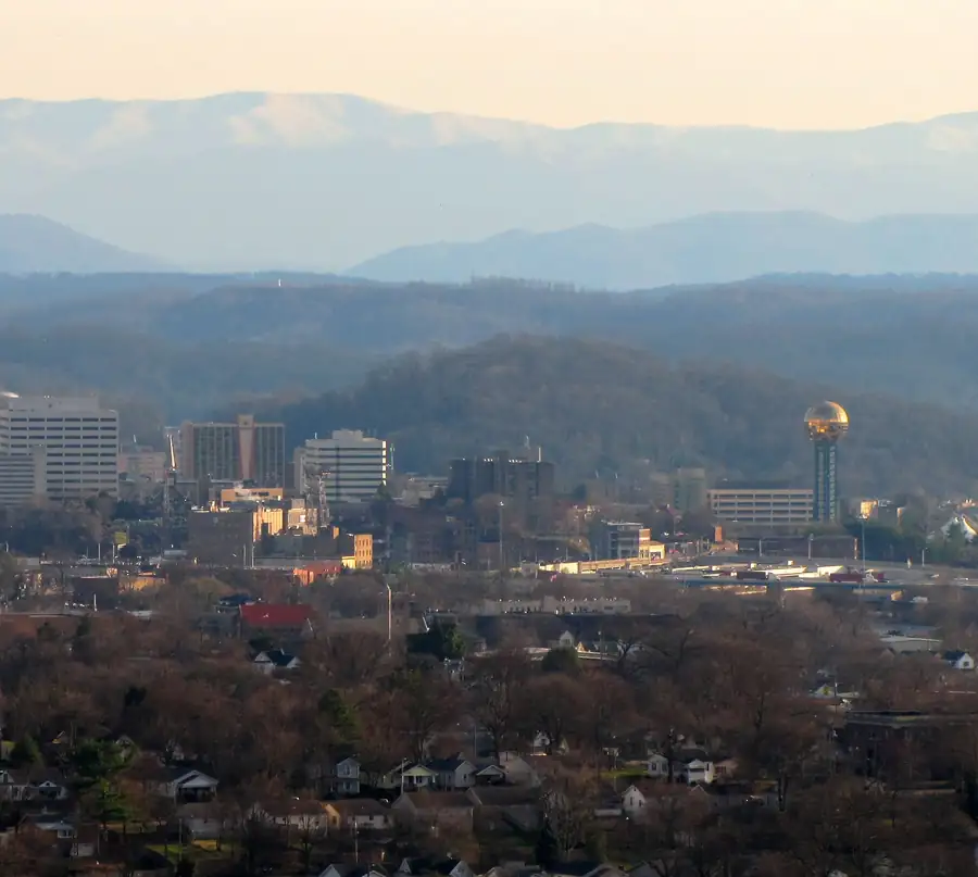 Downtown Knoxville seen from Sharps Ridge, with the Great Smoky Mountains on the horizon in late-day light